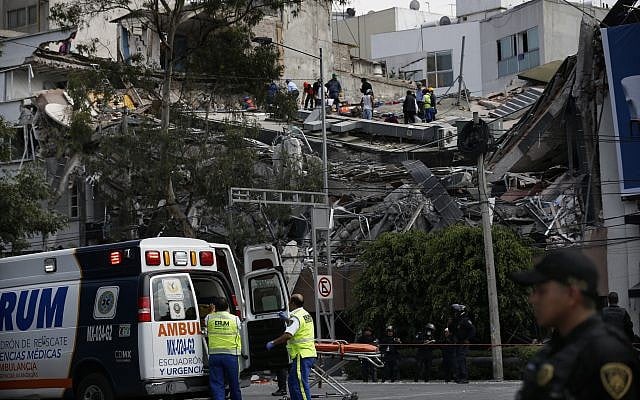 Rescue workers and volunteers search a building that collapsed after an earthquake in the Roma Norte neighborhood of Mexico City, Tuesday, September 19, 2017. (AP Photo/Marco Ugarte) Rescue workers and volunteers search a building that collapsed after an earthquake in the Roma Norte neighborhood of Mexico City, Tuesday, September 19, 2017. (AP Photo/Marco Ugarte)