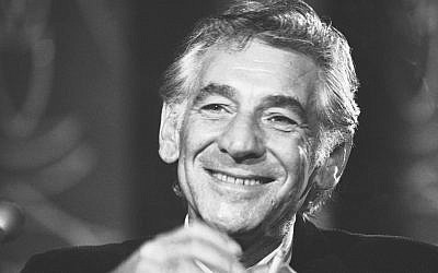 In this July 26, 1971 file photo conductor Leonard Bernstein tells reporters in Washington that the work he is preparing for the 1971 opening of the John F. Kennedy Center for the Performing Arts is a "labor of love."  (AP Photo/Charles Harrity, File)