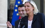In this May 16, 2014 file photo, French far-right Front National Party President Marine Le Pen and vice-president Florian Philippot, left, talk to the media at the Elysee Palace, in Paris, France. (AP Photo/Jacques Brinon, File)