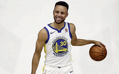 Golden State Warriors' Stephen Curry poses for photos during NBA basketball team media day Friday, Sept. 22, 2017, in Oakland, Calif. (AP Photo/Marcio Jose Sanchez)