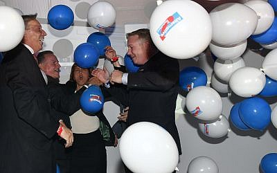 Members of the nationalist German AfD, 'Alternative for Germany', celebrate during the election party in Berlin, Germany, September 24, 2017, after the polling stations for the German parliament elections had been closed. (AP Photo/Martin Meissner)