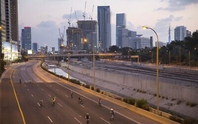Israelis ride their bicycles on a car-free highway on Yom Kippur in Tel Aviv, Friday, Sept 29. 2017. (AP Photo/Oded Balilty)