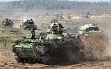 Belarusian army vehicles prepare for war games at an undisclosed location in Belarus on Sept. 11, 2017. (Vayar Military Agency photo via AP)