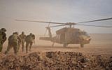 Soldiers run to a helicopter during an exercise in northern Israel simulating a war with the Hezbollah terrorist group in September 2017. (Israel Defense Forces)
