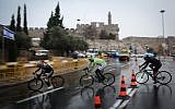 Professional cyclists ride near the Jaffa Gate to Jerusalem's Old City in a race organized by the Jerusalem Municipality, on November 26, 2014. (Hadas Parush/Flash90)
