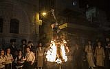 Ultra-Orthodox Jews burn an effigy of an IDF soldier during Lag B'Omer celebrations in the Mea Shearim neighborhood of Jerusalem on May 13, 2017. (Noam Revkin Fenton/Flash90)