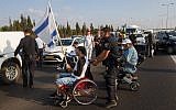 Illustrative photo of disabled protesters blocking a highway outside the town of Yekum on August 14, 2017, as part of demonstrations for higher monthly disability benefits. (Flash90)