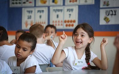 First grade students sit in a classroom on their first day of school at the Borohov school in Givatayim, September 1, 2017. (Miriam Alster/Flash90)