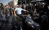 Ultra-Orthodox Jewish clash with Israeli police near the army recruiting office in Jerusalem, September 17, 2017. (Yonatan Sindel/Flash90)