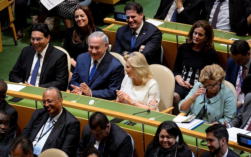 Prime Minister Benjamin Netanyahu and his wife Sara listen to US president Donald Trump address the UN General Assembly at UN headquarters in New York on September 19, 2017. (Avi Ohayon/GPO)