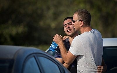 Local residents at the Har Adar settlement, outside Jerusalem, on September 26, 2017, pictured after a Palestinian terrorist killed two security officers and a border policeman there, and seriously injuring another man. (Hadas Parush/FLASH90)