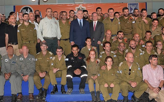 Prime Minister Benjamin Netanyahu is seen with the IDF delegation sent to Mexico to assist in search and rescue efforts following a major earthquake that hit the country, at a ceremony at Ben Gurion International Airport on September 28, 2017.(Amos Ben Gershom/GPO/Flash90) Prime Minister Benjamin Netanyahu is seen with the IDF delegation sent to Mexico to assist in search and rescue efforts following a major earthquake that hit the country, at a ceremony at Ben Gurion International Airport on September 28, 2017.(Amos Ben Gershom/GPO/Flash90)