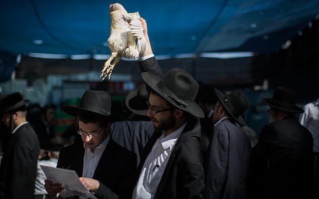 Ultra Orthodox Jews perform the Kaparot ceremony on September 28, 2017, in Jerusalem. Hadas Parush/Flash90) Ultra Orthodox Jews perform the Kaparot ceremony on September 28, 2017, in Jerusalem. Hadas Parush/Flash90)