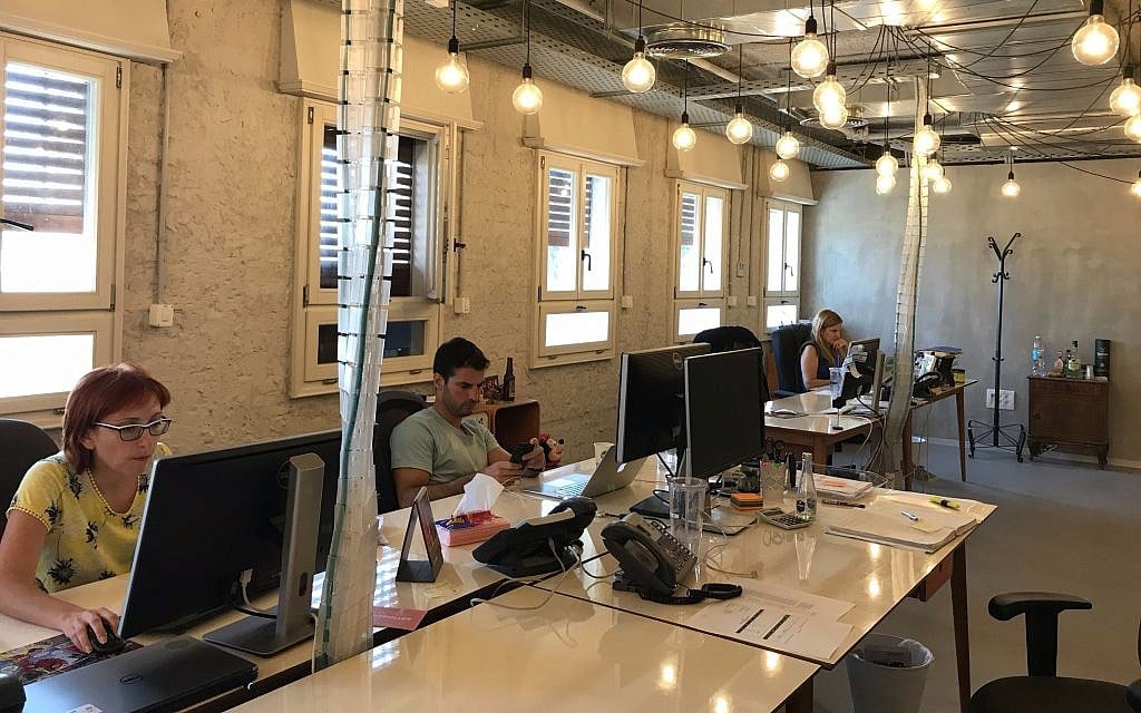 Illustrative: Fiverr employees at work in its Tel Aviv offices, August 6, 2017 (Shoshanna Solomon/Times of Israel)