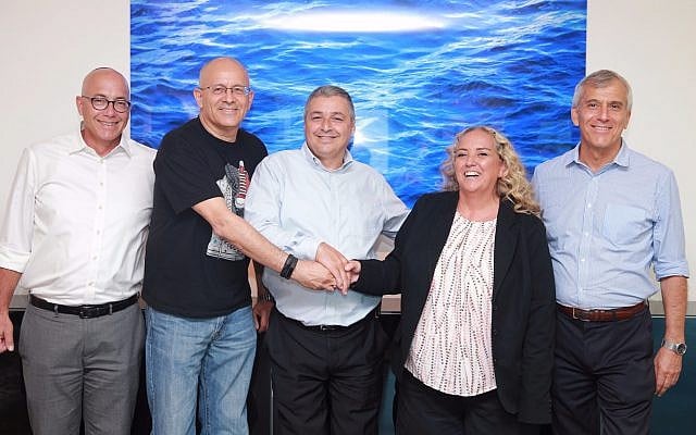 Microsoft Israel CEO, Shelly Landsmann, second from right, with Bank Hapoalim CEO Arik Pinto, center, and Yoram Yaacovi, general manager, Microsoft Israel R&D Center, September 6, 2017 (Courtesy Bank Hapoalim) Microsoft Israel CEO, Shelly Landsmann, second from right, with Bank Hapoalim CEO Arik Pinto, center, and Yoram Yaacovi, general manager, Microsoft Israel R&D Center, September 6, 2017 (Courtesy Bank Hapoalim)