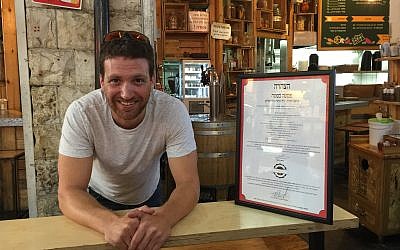Haim Avrahami, one of the two owners of Pasta Basta, a popular restaurant in Jerusalem's Mahane Yehuda market. (Jessica Steinberg/Times of Israel)