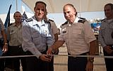Col. Liran Cohen, head of the IDF's air defense school, left, and Col. David Shank, of the US 10th Army Air & Missile Defense Command, cut the ribbon to open the first American military base in Israel, inside the Mashabim Air Base, on September 18, 2017. (Israel Defense Forces)