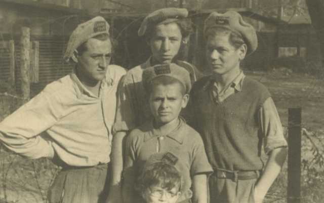 Children posing for a photo in hats that read 'Exodus 1947' in a displaced persons camp in Germany, September 1947. (Robert Gary/via JTA)