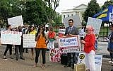 Refugees, advocates and faith leaders rallying in front of the White House to call for refugee protections on World Refugee Day, June 20, 2017. (HIAS via JTA)