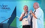 Israeli entrepreneur Yossi Vardi (L) speaks to Amazon's Werner Vogels during an Invest in Israel event aat DLD Tel Aviv, September 6, 2017. (Courtesy)
