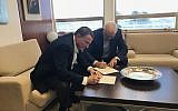 Manuel Trajtenberg (R) presents Knesset Speaker Yuli Edelstein with his official resignation from parliament as a Zionist Union MK, October 1, 2017. (Knesset Speaker)