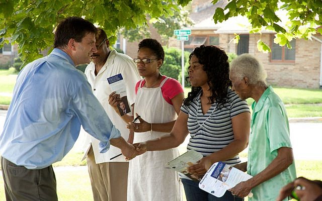 Brad Schneider, then a candidate for Congress in Illinois, greeting voters at the North Chicago Community Days Parade, August 6, 2011. (Courtesy Schneider for Congress) Brad Schneider, then a candidate for Congress in Illinois, greeting voters at the North Chicago Community Days Parade, August 6, 2011. (Courtesy Schneider for Congress)
