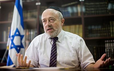 Rabbinical Courts Administration Director Shimon Yaakovi speaking during an interview in his office in Jerusalem, July 27, 2015. (Yonatan Sindel/Flash90/via JTA)