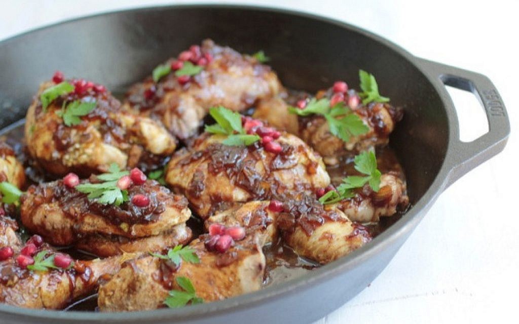 Pomegranate and honey glazed chicken. (Liz Rueven/via JTA)