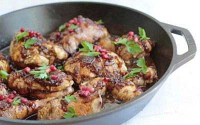 Pomegranate and honey glazed chicken. (Liz Rueven/via JTA)
