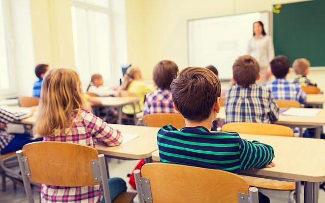 Illustrative image of school children and teacher in classroom. (dolgachov, iStock/Getty Images) Illustrative image of school children and teacher in classroom. (dolgachov, iStock/Getty Images)