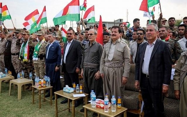 Kirkuk's provincial governor Najim al-Din Karim (3rd-R), who was sacked by the Iraqi parliament the previous week, attends a rally in support of the upcoming independence referendum in Kirkuk on September 19, 2017, accompanied by the former speaker of the Kurdistan parliament and leading member of the Kurdistan Democratic Party, Kamal Kirkuki (2nd-R). (AFP PHOTO / Marwan IBRAHIM) Kirkuk's provincial governor Najim al-Din Karim (3rd-R), who was sacked by the Iraqi parliament the previous week, attends a rally in support of the upcoming independence referendum in Kirkuk on September 19, 2017, accompanied by the former speaker of the Kurdistan parliament and leading member of the Kurdistan Democratic Party, Kamal Kirkuki (2nd-R). (AFP PHOTO / Marwan IBRAHIM)