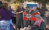 Men attending a Michigan cultural event to re-enact World War ll caused uproar by posing with a Nazi flag for a photograph that went viral on Facebook , September 24, 2017. (Screenshot)