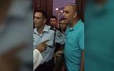 Lod Mayor Yair Revivo, right, shouts at worshipers at a mosque in the city to stop prayers being broadcast over the PA system, September 1, 2017. (Screenshot)