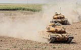 Illustrative: Iraqi and Turkish tanks take part in a military exercise near the border with Iraqi Kurdistan at Silopi district in Sirnak on September 26, 2017. (AFP Photo/Ilyas Akengin)