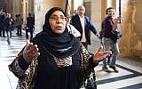 Zoulikha Aziri, mother of Mohamed Merah, gestures as she speaks to journalists on October 2, 2017 at a Paris court house before the opening of the trial of Abdelkader Merah, who stands accused of complicity in the series of shootings commited by his jihadist brother in Toulouse and Montauban in 2012. (AFP/Eric Feferberg)