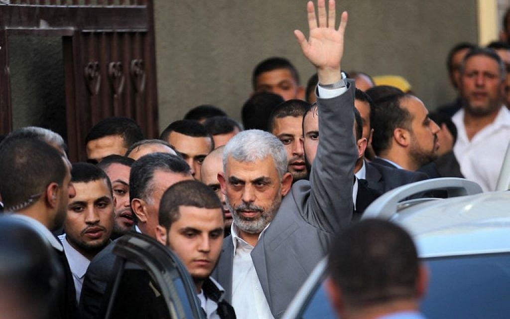 Hamas's leader in the Gaza Strip Yahya Sinwar waves as he arrives for a meeting  with Palestinian prime minister and other officials in Gaza City October 2, 2017. (AFP Photo/Said Khatib)