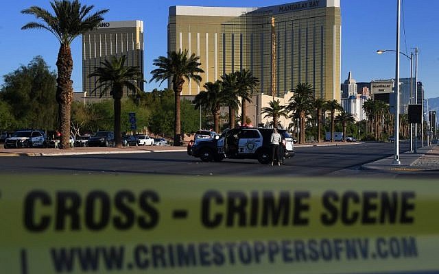 Crime scene tape surrounds Las Vegas's Mandalay Bay Hotel (background) after a gunman killed 59 people and wounded more than 500 others when he opened fire on a country music concert in the city on October 2, 2017. (AFP/Mark Ralston) Crime scene tape surrounds Las Vegas's Mandalay Bay Hotel (background) after a gunman killed 59 people and wounded more than 500 others when he opened fire on a country music concert in the city on October 2, 2017. (AFP/Mark Ralston)