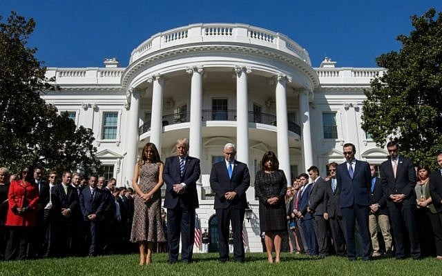 US President Donald Trump, First Lady Melania Trump, US Vice President Mike Pence and Second Lady Karen Pence take part in a moment of silence on the South Lawn of the White House on October 2, 2017, in honor of the victims of the mass shooting in Las Vegas, Nevada. (AFP Photo/Mandel Ngan) US President Donald Trump, First Lady Melania Trump, US Vice President Mike Pence and Second Lady Karen Pence take part in a moment of silence on the South Lawn of the White House on October 2, 2017, in honor of the victims of the mass shooting in Las Vegas, Nevada. (AFP Photo/Mandel Ngan)