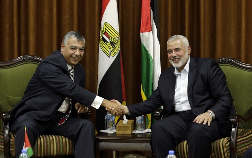 Hamas chief Ismail Haniyeh, right, meets with Egyptian Intelligence Minister Khalid Fawzi at the former's office in Gaza City on October 3, 2017. (AFP Photo/Mahmud Hams) Hamas chief Ismail Haniyeh, right, meets with Egyptian Intelligence Minister Khalid Fawzi at the former's office in Gaza City on October 3, 2017. (AFP Photo/Mahmud Hams)