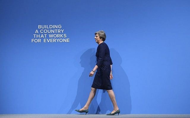 Britain's Prime Minister Theresa May takes the stage to deliver her speech on the final day of the Conservative Party annual conference at the Manchester Central Convention Centre in Manchester, northwest England, on October 4, 2017. (AFP PHOTO / Oli SCARFF) Britain's Prime Minister Theresa May takes the stage to deliver her speech on the final day of the Conservative Party annual conference at the Manchester Central Convention Centre in Manchester, northwest England, on October 4, 2017. (AFP PHOTO / Oli SCARFF)