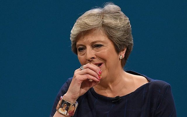 Britain's Prime Minister Theresa May coughs as she delivers a speech on the final day of the annual Conservative Party conference at the Manchester Central Convention Centre in Manchester, England, on October 4, 2017. (AFP Photo/Paul Ellis) Britain's Prime Minister Theresa May coughs as she delivers a speech on the final day of the annual Conservative Party conference at the Manchester Central Convention Centre in Manchester, England, on October 4, 2017. (AFP Photo/Paul Ellis)