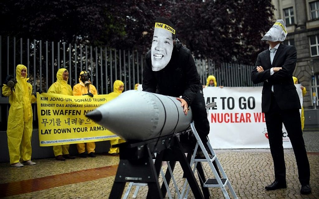 In this picture taken on September 13, 2017, activists of the International campaign to abolish Nuclear Weapons (ICAN) wear masks of US President Donald Trump (R) and North Korea's leader Kim Jong Un as they demonstrate in front of the US embassy in Berlin. (AFP/dpa/Britta Pedersen) In this picture taken on September 13, 2017, activists of the International campaign to abolish Nuclear Weapons (ICAN) wear masks of US President Donald Trump (R) and North Korea's leader Kim Jong Un as they demonstrate in front of the US embassy in Berlin. (AFP/dpa/Britta Pedersen)
