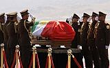 Honor guards salute next to the coffin of former Iraqi president Jalal Talabani during a ceremony at the airport in the Iraqi Kurdish city of Sulaimaniyah on October 6, 2017. (AFP Photo/Shwan Mohammed)