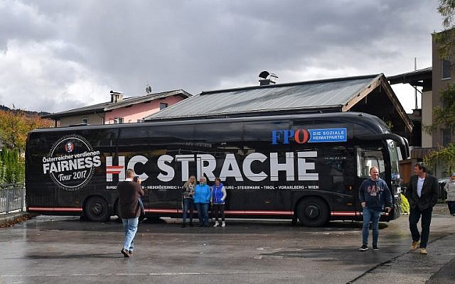 Supporters pose for pictures in front of the campaign bus of the chairman of the far-right Freedom Party of Austria (FPOe) during one of his campaign meetings ahead of snap elections, October 6, 2017, in Saalfelden. (AFP/WILDBILD) Supporters pose for pictures in front of the campaign bus of the chairman of the far-right Freedom Party of Austria (FPOe) during one of his campaign meetings ahead of snap elections, October 6, 2017, in Saalfelden. (AFP/WILDBILD)