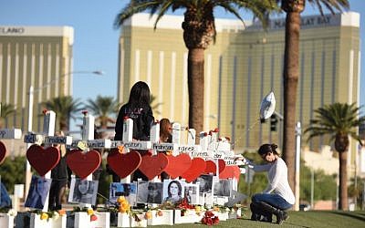 58 white crosses for the victims of Sunday night's mass shooting on the Las Vegas Strip just south of the Mandalay Bay hotel, October 6, 2017 in Las Vegas, Nevada. (AFP/Robyn Beck)
