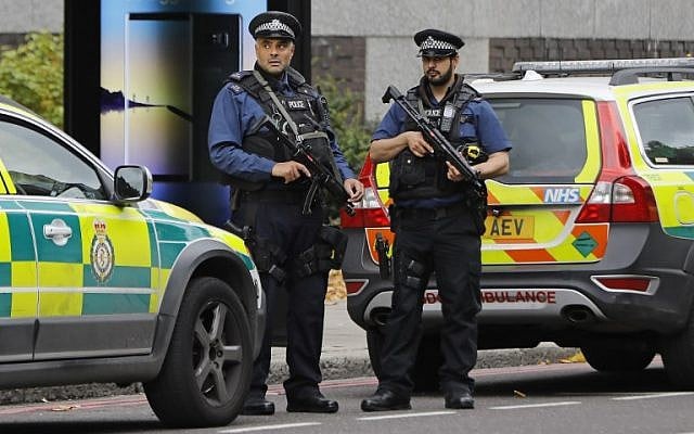 Illustrative: Armed police officers on duty in London, at the junction of Exhibition Road and Cromwell Road, between the Victoria and Albert Museum and the Natural History Museum, October 7, 2017. (AFP/Tolga Akmen) Illustrative: Armed police officers on duty in London, at the junction of Exhibition Road and Cromwell Road, between the Victoria and Albert Museum and the Natural History Museum, October 7, 2017. (AFP/Tolga Akmen)