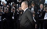 This file photo taken on May 24, 2013 shows US producer Harvey Weinstein posing on May 24, 2013 as he arrives for the screening of the film "The Immigrant" in Cannes. (AFP/ANNE-CHRISTINE POUJOULAT)