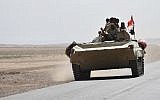 Iraqi army reinforcements drive down a road, linking Hawija to Kirkuk, near the village of Khabbaz on October 7, 2017. (AFP PHOTO / Marwan IBRAHIM)