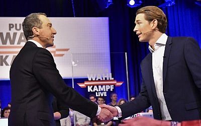 Chancellor of Austria and chairman of the Social Democratic Party of Austria (SPOe), Christian Kern (L) shakes hands with Minister for Foreign Affairs and chairman of the Austrian People's Party (OeVP), Sebastian Kurz (R), upon their arrival on a set of Austrian Plus 4 TV, October 8, 2017 in Vienna. (AFP PHOTO / APA / HERBERT NEUBAUER)