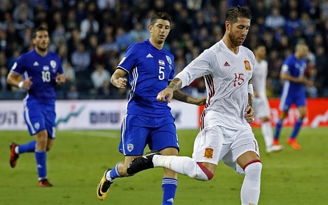 Spain's defender Sergio Ramos r) controls the ball past Israel's midfielder Marwan Kabha during the Russia 2018 FIFA World Cup European Group G qualifying football match between Israel and Spain at Teddy Stadium in Jerusalem on October 9, 2017.
(AFP PHOTO / JACK GUEZ) Spain's defender Sergio Ramos r) controls the ball past Israel's midfielder Marwan Kabha during the Russia 2018 FIFA World Cup European Group G qualifying football match between Israel and Spain at Teddy Stadium in Jerusalem on October 9, 2017.
(AFP PHOTO / JACK GUEZ)
